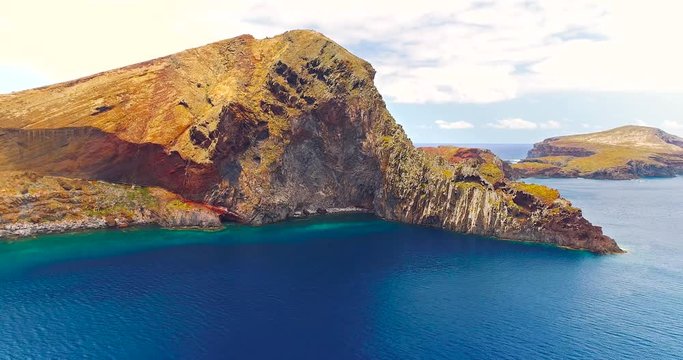 Aerial side view of beautiful cliffs and ocean at Sao Lourenco peninsula, Madeira Island, Portugal