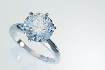 Solitaire diamond engagement ring on white background