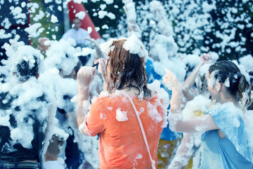 man in a soapy foam at the festival disco