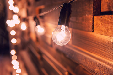 Modern dark classical style interior design apartment with retro lamps hanging light bulbs...