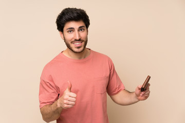 Handsome man holding a wallet