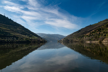 View of Douro River with terraced vineyards near the village of Pinhao, in Portugal; Concept for travel in Portugal and most beautiful places in Portugal