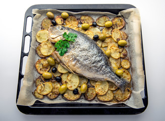 Baked sea bream with potatoes and olives