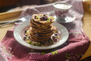 tasty breakfast in bed from eastern pancakes and Masala tea, served on the wood folding breakfast table