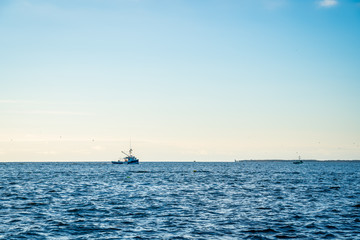 Lobster fishing boat scenery of Canada's Atlantic coast with a beautiful sky.