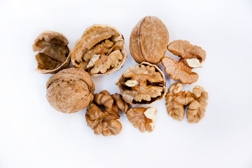 Healthy food and snack. Walnuts kernels on white background. Fruits of walnut.