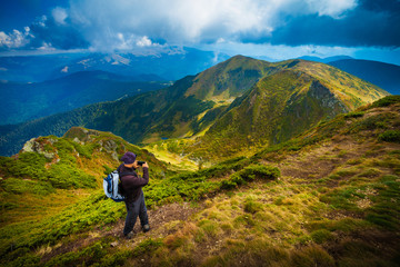 Hiker in beautiful mountain landscape, sense of freedom concept