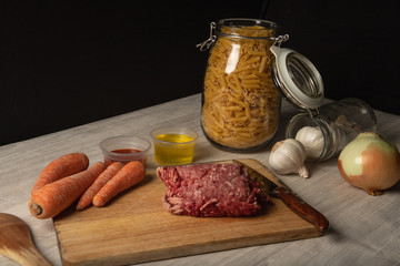 still life of minced meat, preparation of macaroni bolognese