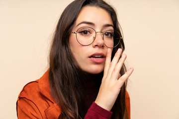 Fototapeta premium Teenager girl with coat whispering something