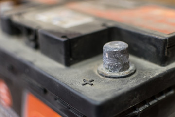 car battery with positive red contact for the repair of the machine