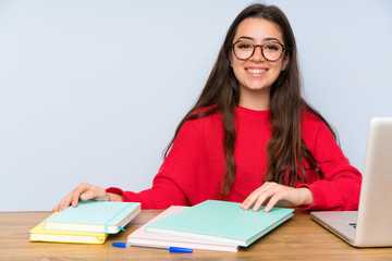 Happy Teenager student girl studying in a table