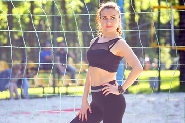 beautiful sports girl standing near the sports complex