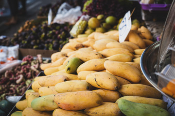 Fruit counter with mango fruits on the market