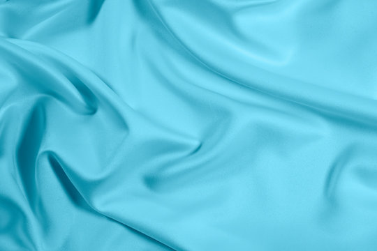 Closeup Of Rippled Light Blue Satin Fabric