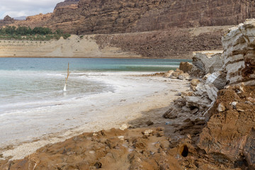 dead sea shore with salt in jordan