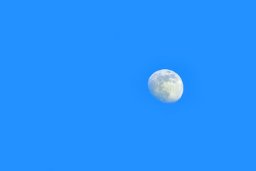 Moon on blue sky, daytime