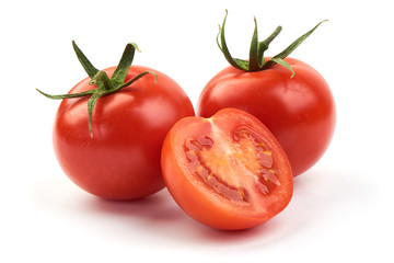 Fresh ripe tomatoes, close-up, isolated on white background