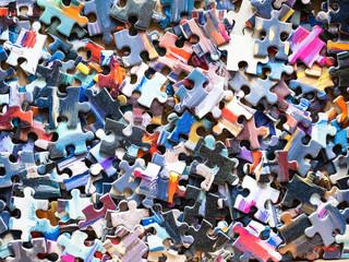 Obraz premium pile of disassembled jigsaw puzzle tiles