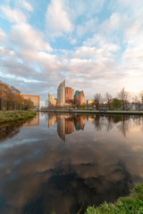 Obraz premium Sunrise on The Hague cityscape reflected on the water at the spring season