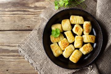 Homemade Potato Gnocchi. Flat lay. Black background.