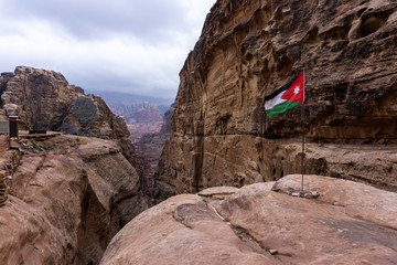 Jordan flag in mountain view in Petra