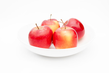 four apples in a bowl