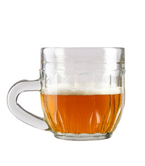 half a glass of beer in a traditional mug