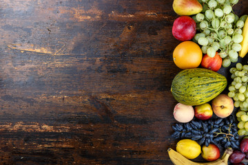Obraz na płótnie Canvas bright fruit on wooden background