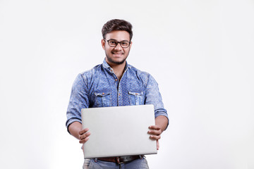  Young indian man with laptop