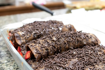granulated chocolate pancake with strawberry