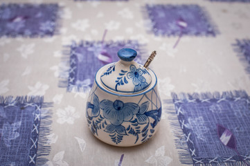 Beautiful colorful bowl for sugar on table