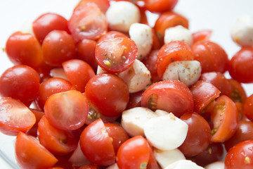  Home cooking. Salad of cherry tomatoes and mozzarella with spices.