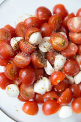  Home cooking. Salad of cherry tomatoes and mozzarella with spices.