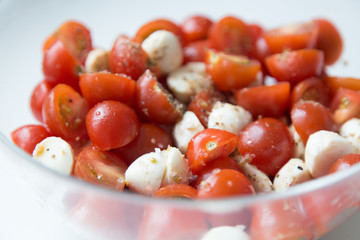  Home cooking. Salad of cherry tomatoes and mozzarella with spices.