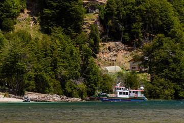 Scene view of ship arriving at port in Espolón Lake, Futaleufú, Chile