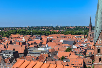 Fototapeta premium Lueneburg, Germany - June 5, 2018: View from the old water tower of the historic Hanseatic city of Lueneburg, Germany, over the rooftops of the old town.