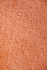 Abstract orange background texture rare vintage cement wall.  