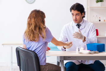 Female patient visiting male doctor for regular check-up 
