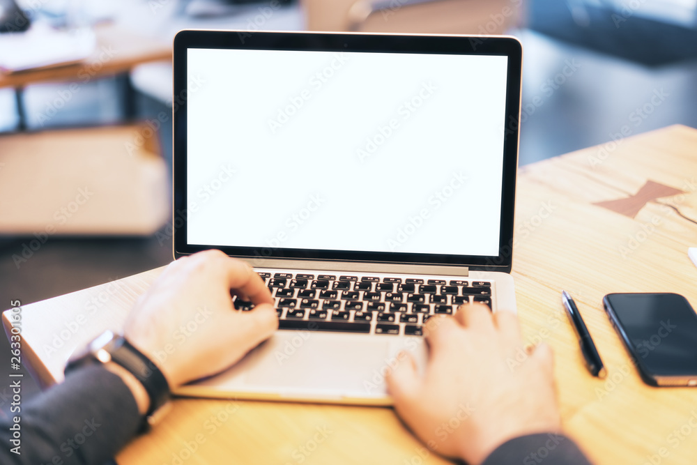 Poster man using white notebook screen on desktop