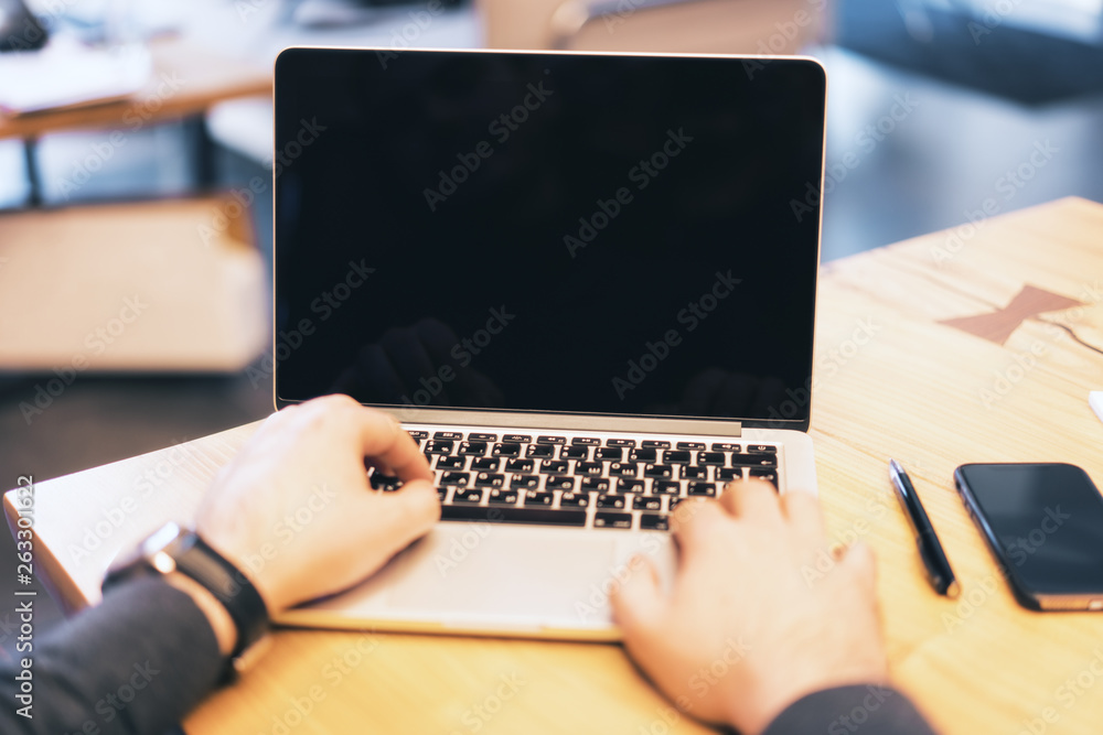 Aufkleber man using blank notebook screen on desktop