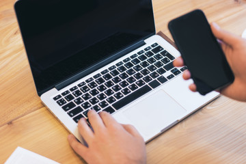 Man using empty laptop screen on desktop