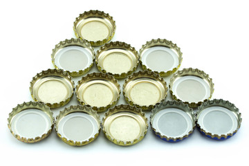 Metal cover from glass bottles. Decorative beer caps on white background.