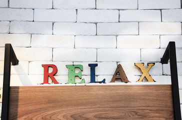 sign relax on the wall