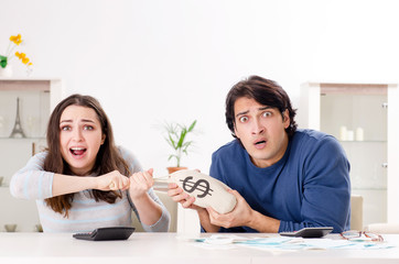 Young couple in budget planning concept 
