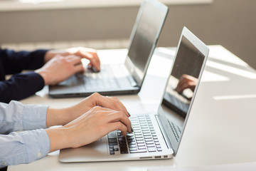 Business man or accountant working on laptop computer with business document