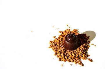 Granulated instant coffee with chocolate sweet on a white background,photo