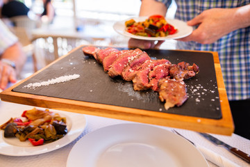 Family enjoy beef and wine good on a holiday