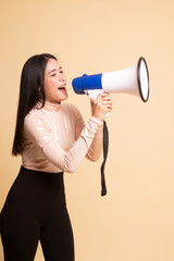 Beautiful young Asian woman announce with megaphone.
