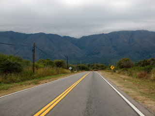 A road near Villa de Merlo, San Luis, Argentina, with the Comechingones mountains in the background.