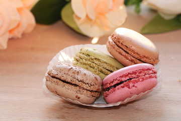 Fresh macaroons on a light background. Extremely shallow depth of field with selective focus in the foreground.
